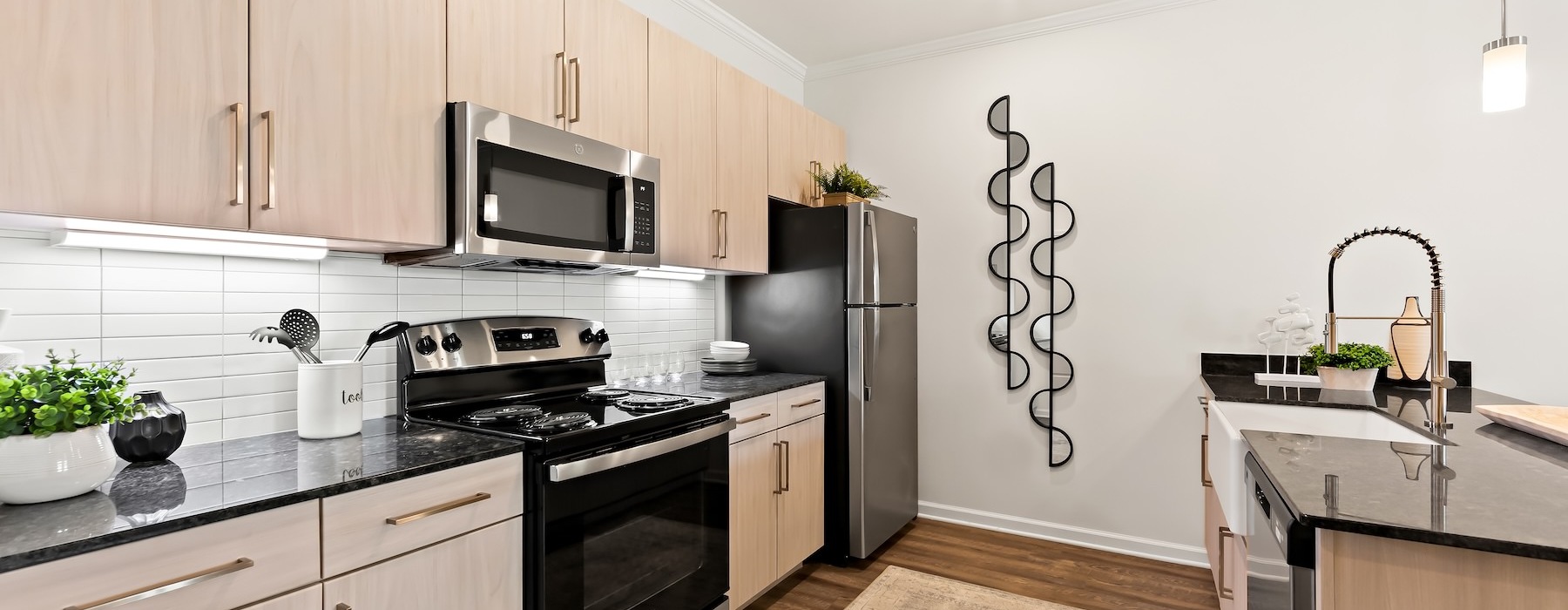a kitchen with black appliances