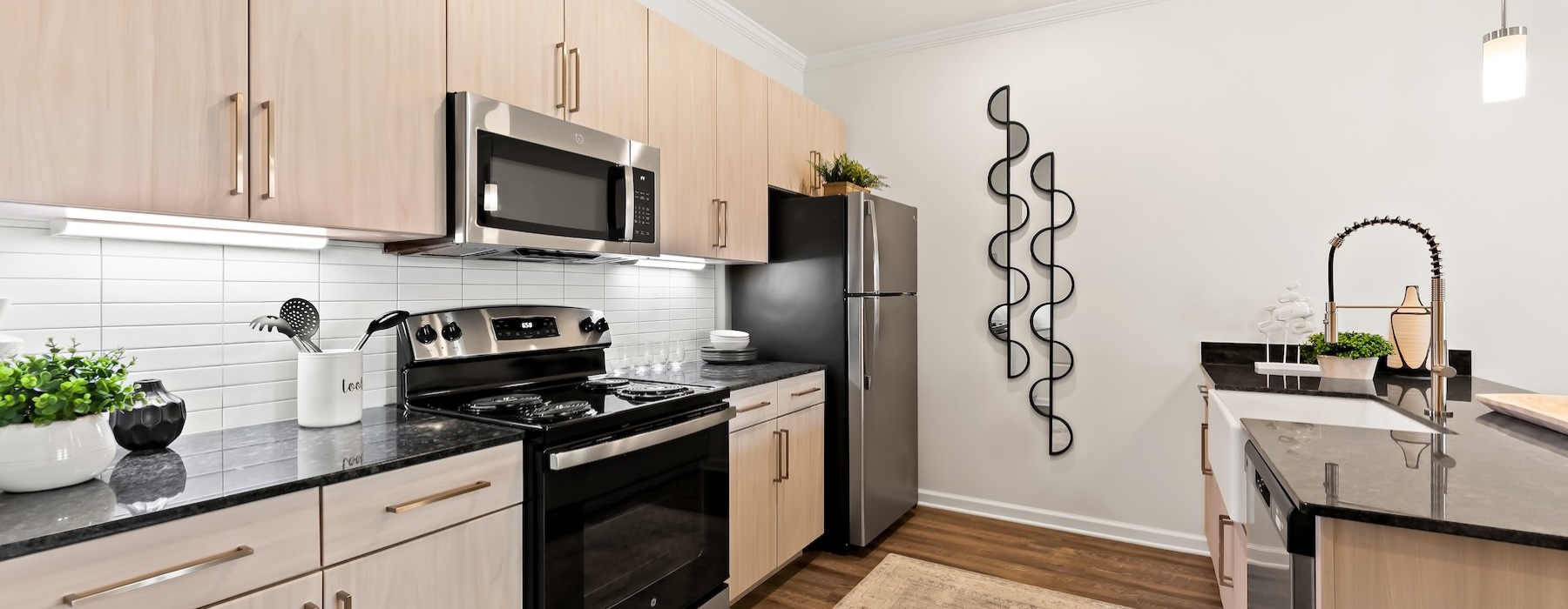 a kitchen with black appliances