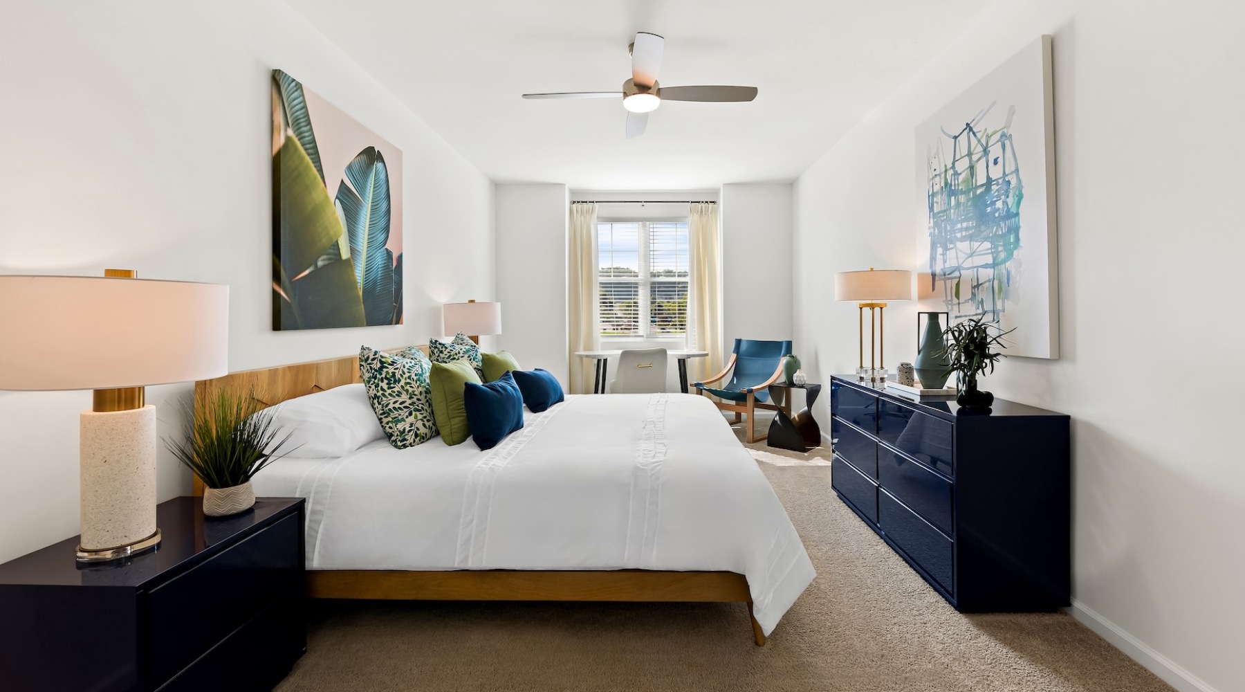 a bedroom with a bed and a dresser