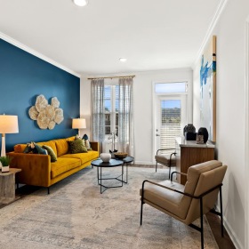 a living room with a blue wall